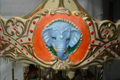 Carrousel musical en biscuit peint, XXème siècle, réfection d'un macaron éléphant après restauration
